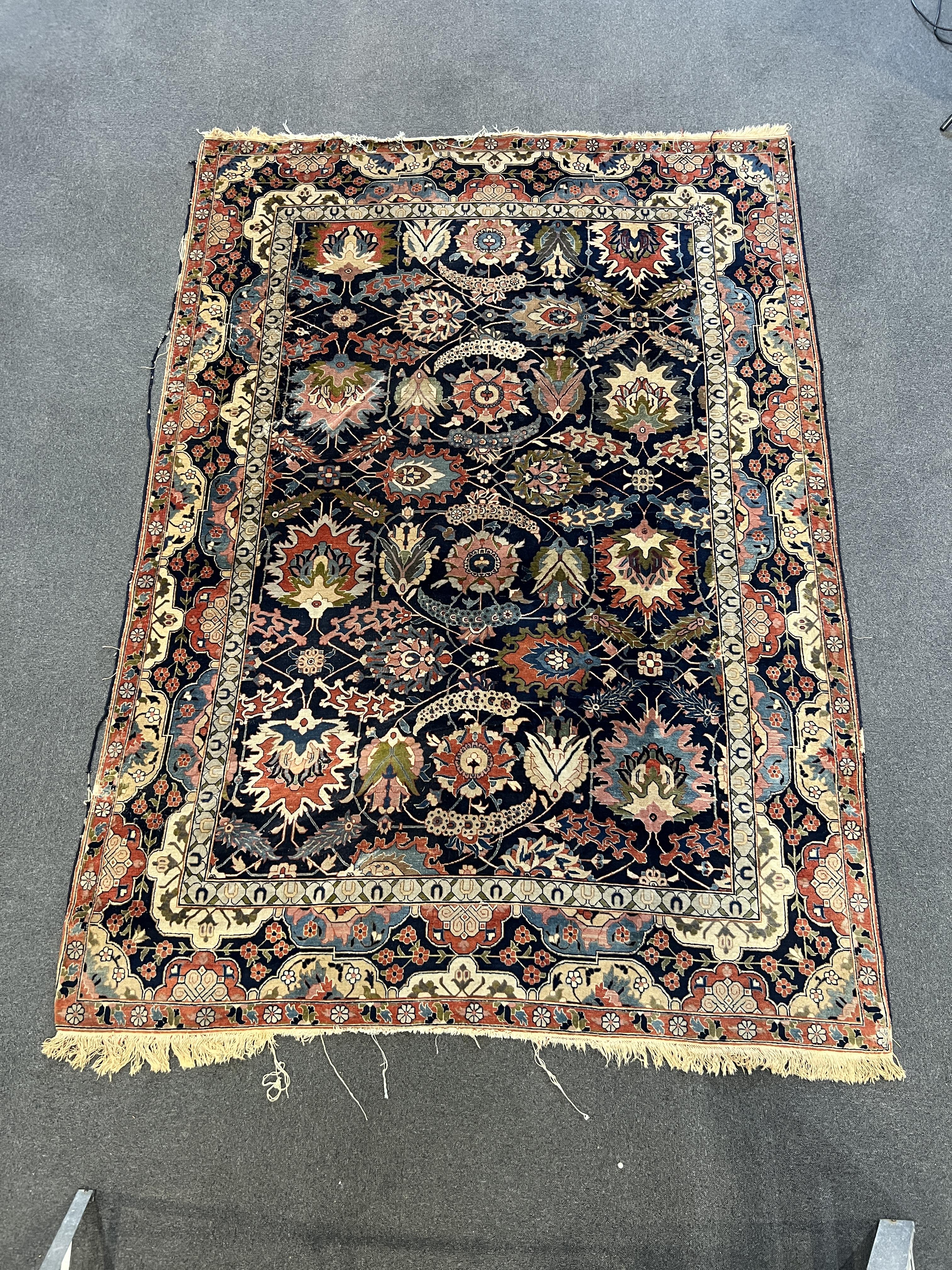 An early 20th century Benlian Tabriz carpet, signed Mahmud, 320 x 225cm